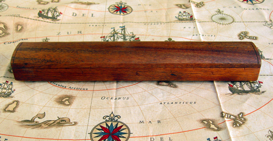 Box, Carved out of solid mahogany with traditional linseed oil and wax finish and antiqued brass feet and pegs.